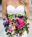 Multi-Colored Bridal Bouquet
Photography: Kent Drake Photography
Read More:
http://www.insideweddings.com/weddings/bright-and-colorful-wedding-palette-with-ceremony-overlooking-lake/1315/ vibrant bridal bouquet with bright pink peonies, flowers in purple, peach, and yellow