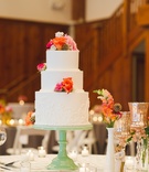 Peach Flower Cake
Photography: Sharayamauck Photography
Read More:
http://www.insideweddings.com/weddings/an-artistic-fall-wedding-at-a-rustic-lodge-in-kansas/607/ white tiered cake with orange flowers on side and top