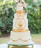 Ornate, Regal Wedding Cake
Photography: Allison Lewis Photography
Read More:
http://www.insideweddings.com/weddings/elegant-alfresco-garden-party-wedding-with-pastel-color-palette/1024/ ornate, regal wedding cake with gold details and fresh flowers