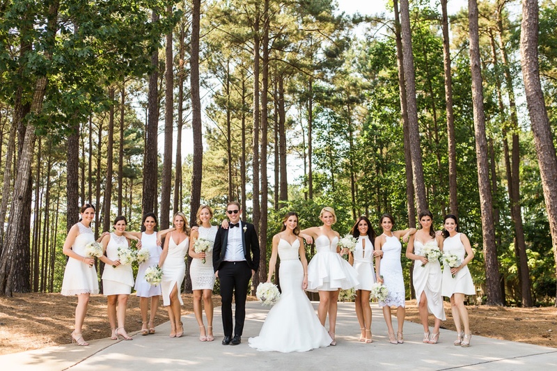 Mismatched Short White Bridesmaid Dresses
Photography: Vue Photography
Read More:
http://www.insideweddings.com/weddings/summer-destination-wedding-with-rustic-elegant-decor-in-georgia/1032/ Bridesmaids in mismatched white dresses short with bridesman in tuxedo in woods georgia