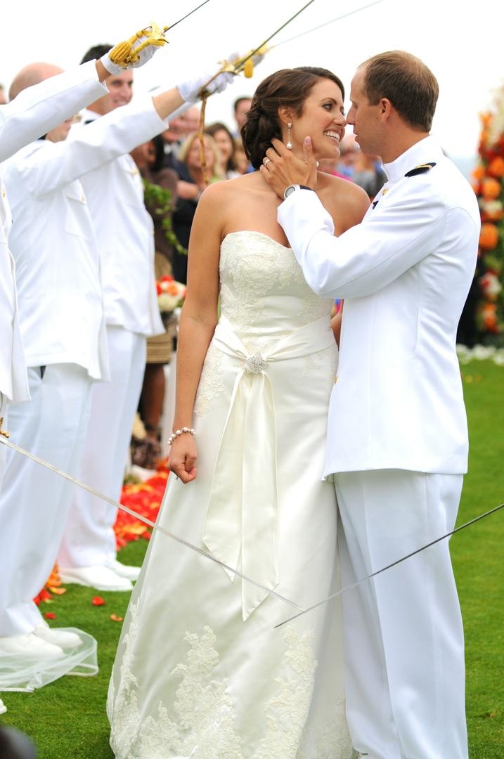 Arch of Swords Ceremony
Photography: TripleCord Photography
Read More:
http://www.insideweddings.com/weddings/beachside-summer-wedding-at-the-montage-laguna-beach/287/ US Navy lieutenant and wife kiss between sword