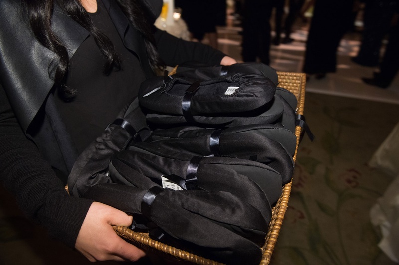 Comfortable Satin Flats at Reception
Photography: John Solano Photography
Read More:
http://www.insideweddings.com/weddings/an-opulent-garden-ceremony-ballroom-reception-in-beverly-hills/986/ Server carrying around basket of black satin flat shoe slippers for dancing at wedding reception