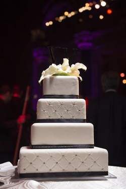 Photography: Brett Matthews Photography
Read More:
http://www.insideweddings.com/inspiration/board/218/iwadmin2/beautiful-black-wedding-details/ White wedding cake with quilted layers dotted with rhinestones, topped with white calla lilies