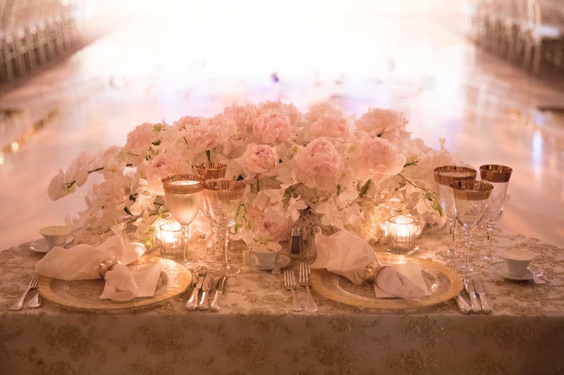 Sweetheart Table with Embroidered Linens
Photography: The Day by Ira Lippke
Read More:
http://www.insideweddings.com/weddings/opulent-luxury-wedding-with-timeless-color-palette-in-new-york-city/1199/ wedding reception sweetheart table dance floor semi circle pink peony white orchid gold glasses