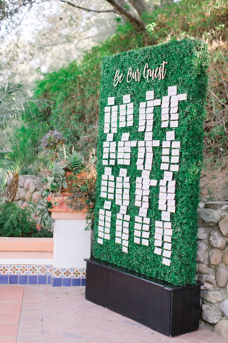 "Be Our Guest" Hedge Wall
Photography: Anya Kernes Photography
Read More:
http://www.insideweddings.com/weddings/outdoor-wedding-with-dusty-rose-powder-blue-lavender-palette/1288/ wedding reception tall green hedge wall with escort cards be our guest calligraphy sign outdoor
