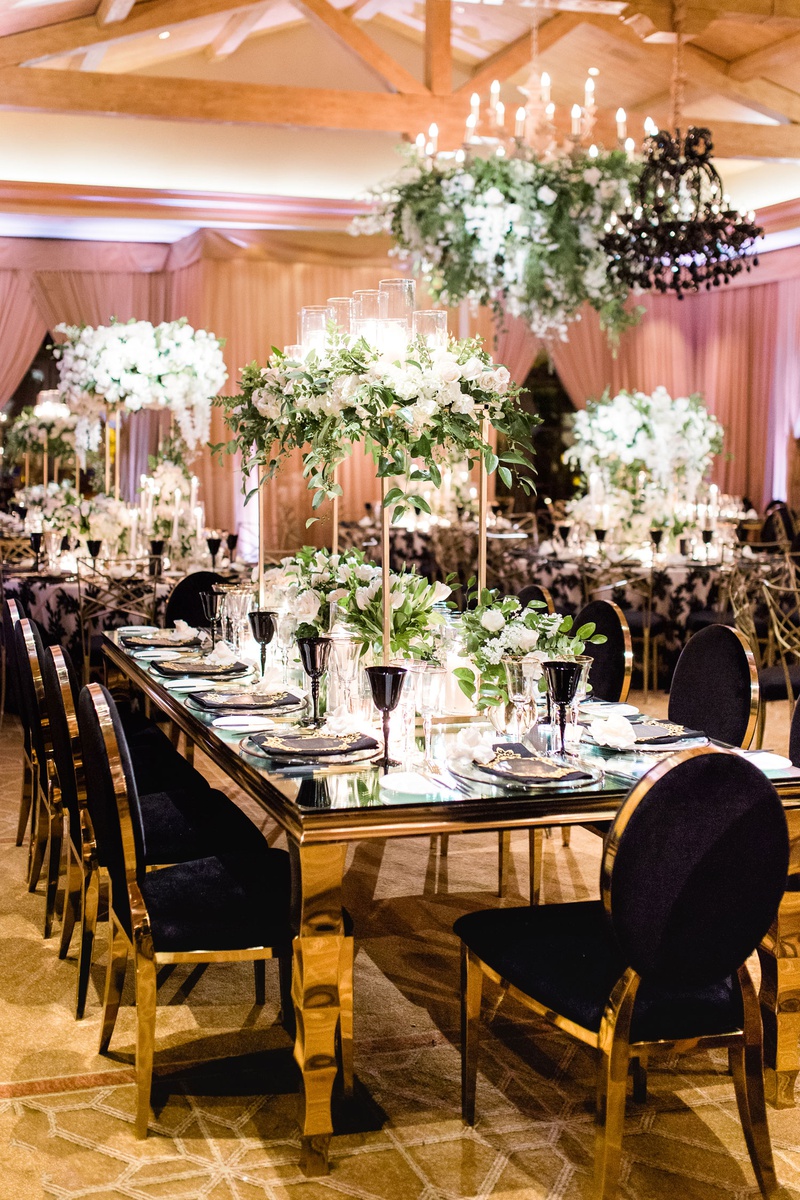 Gold Table %26 Chairs at Luxe Reception
Photography: Brett Hickman Photographers
Read More:
http://www.insideweddings.com/weddings/charlise-castro-and-george-springer-iii/1165/ Charlise Castro and George Springer wedding reception table black chair velvet gold table flowers
