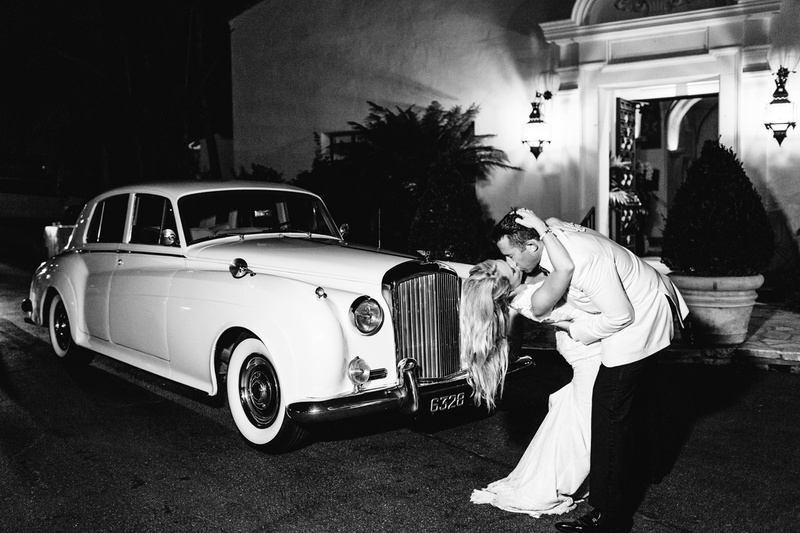 Kiss in Front of Rolls Royce
Photography: Jodee Debes Photography
Read More:
http://www.insideweddings.com/weddings/elegant-alfresco-ceremony-reception-with-parisian-elements/1176/ black and white photo of bride and groom kissing in front of rolls royce classic car wedding