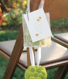 Ceremony Seating Decorations
Photography: Barber Photography
Read More:
http://www.insideweddings.com/weddings/tropical-backyard-wedding-with-bright-citrus-hues-in-san-diego/121/ Balls of green mums were attached to bags of flower petals for guests to throw