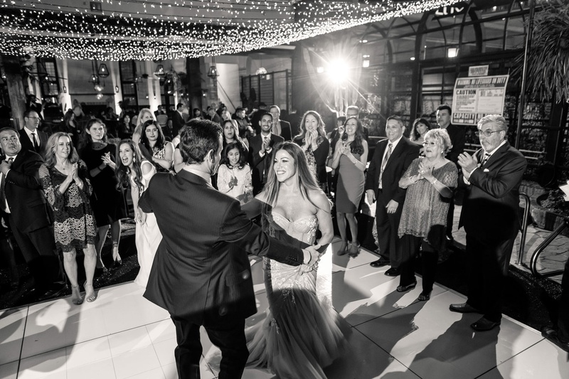 Alfresco First Dance Under Lights
Photography: Maya Myers Photography
Read More:
http://www.insideweddings.com/weddings/candlelit-jewish-ceremony-unique-cozy-outdoor-reception-in-la/1346/ black and white photo of bride and groom dancing guests watching first dance under string lights