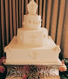Original Wedding Cake
Photography: Tina Carlone Photography
Read More:
http://www.insideweddings.com/weddings/mediterranean-inspired-newport-beach-wedding/39/ White wedding cake with fleur de lis design
