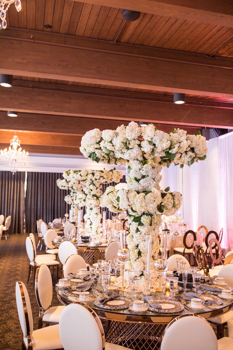 Lush Floral Tree %26 Custom Gold Table
Photography: Brian Bossany Photography
Read More:
http://www.insideweddings.com/weddings/luxurious-heaven-inspired-royal-wedding-celebration-in-minneapolis/1333/ wedding reception gold table tall centerpiece tree white flowers hydrangea rose orchid flowers
