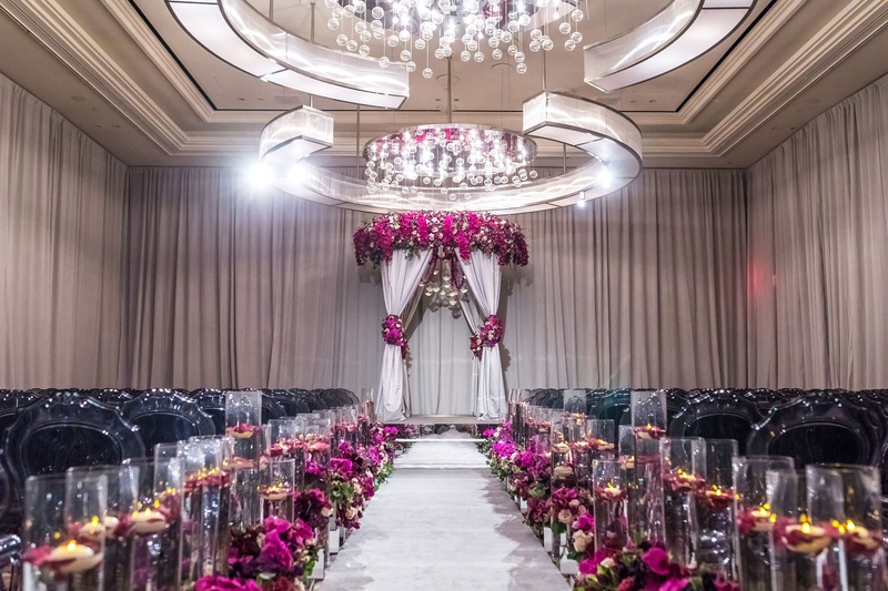 Deep Hues at Ceremony
Photography: Brian Leahy Photography
Read More:
http://www.insideweddings.com/weddings/a-hawaiian-couples-luxurious-destination-wedding-in-las-vegas/1226/ elegant las vegas wedding ceremony, fuchsia flowers, mirrored details, floating candles, grey chairs