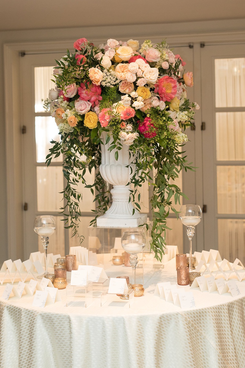 Summery Display of Florals at Table
Photography: Ashley Paige Photography
Read More:
http://www.insideweddings.com/weddings/romantic-ocean-view-ceremony-charming-reception-in-california/1337/ wedding reception escort card table pink orange yellow rose peony flowers greenery escort cards