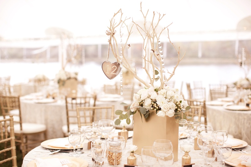 Handmade Wedding Centerpiece
Photography: Jana Williams Photography
Read More:
http://www.insideweddings.com/weddings/ivory-gold-blush-lakefront-new-hampshire-wedding/412/ Keri Lynn Pratt's DIY wedding table decorations