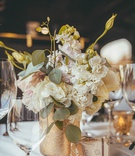 Florals in Vintage Gold Vase
Photography: Erica Djafroodi Photography
Read More:
http://www.insideweddings.com/weddings/intimate-outdoor-ceremony-at-inn-reception-on-a-train-car-in-napa/1347/ small floral centerpiece with white and blush flowers and eucalyptus in gold vase