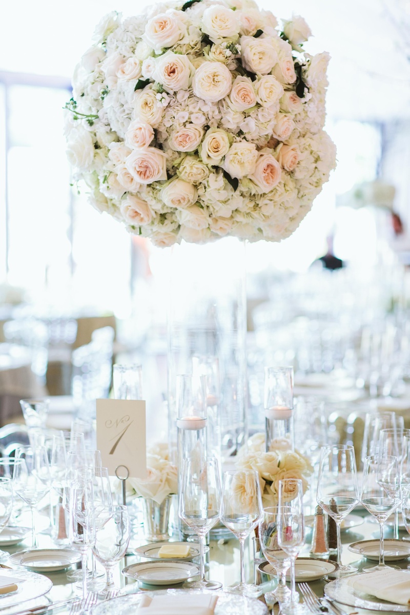 Round Floral Centerpiece
Photography: David %26 Tammy Molnar
Read More:
http://www.insideweddings.com/weddings/an-exquisite-backyard-wedding-in-tennessee/532/ Cylindrical vase topped with white and pink flowers