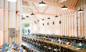 Farmhouse-Style Reception Venue
Photography: Braedon Photography
Read More:
http://www.insideweddings.com/weddings/colorful-wedding-featuring-a-punchy-peach-palette/1173/ wedding reception at lombardi house in los angeles long farm tables blue glassware greenery