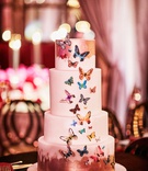 Wedding Cake with Butterfly Motif
Photography: KingenSmith
Read More:
http://www.insideweddings.com/weddings/luxurious-wedding-featuring-sentimental-butterfly-decor-in-chicago/1348/ four layer wedding cake with brushstroke accents and colorful butterfly design applique