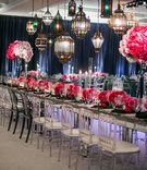 Moroccan Lantern Lighting
Photography: Troy Grover Photographers
Read More:
http://www.insideweddings.com/weddings/jet-setter-couples-modern-wedding-with-travel-inspired-elements/528/ Mirror reception table with pink flowers and colorful glass lanterns