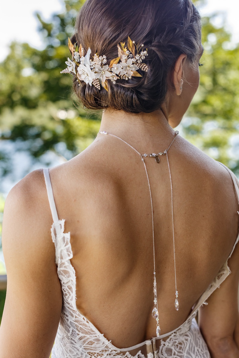 Ivory and Gold Floral Headpiece
Photography: Amy Anaiz Photography
Read More:
http://www.insideweddings.com/weddings/lakeside-wedding-with-blue-details-in-upstate-new-york/1140/ bridal headpiece with gold leaves and white flowers on bridal updo, back necklace