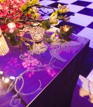 Etched-Glass Tabletop
Photography: Images by Berit, Inc.
Read More:
http://www.insideweddings.com/weddings/contemporary-ballroom-wedding-with-pops-of-purple/408/ Mirror reception table with etched pattern and mossy candles
