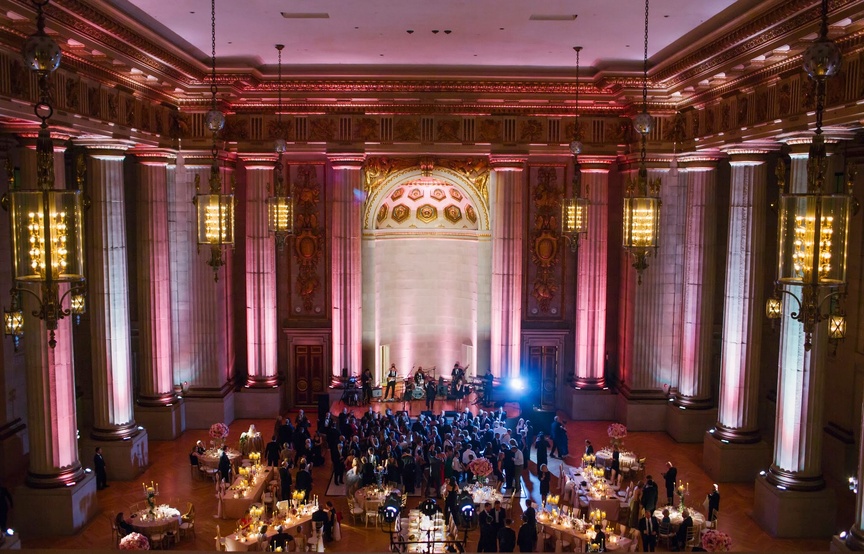 Lively Reception
Article: How Music Moves Your Celebration Along
Photography: Justine Ungaro
Read More:
http://www.insideweddings.com/news/expert-advice/how-music-moves-your-celebration-along/1531/ The Source Band for Elan Artists play at a pink wedding reception at Andrew W. Mellon Auditorium
