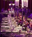 Purple Wedding Centerpieces
Photography: KingenSmith
Read More:
http://www.insideweddings.com/weddings/interfaith-candlelit-ceremony-glamour-purple-reception/370/ Tall candlesticks on wedding table with purple orchid and rose flowers