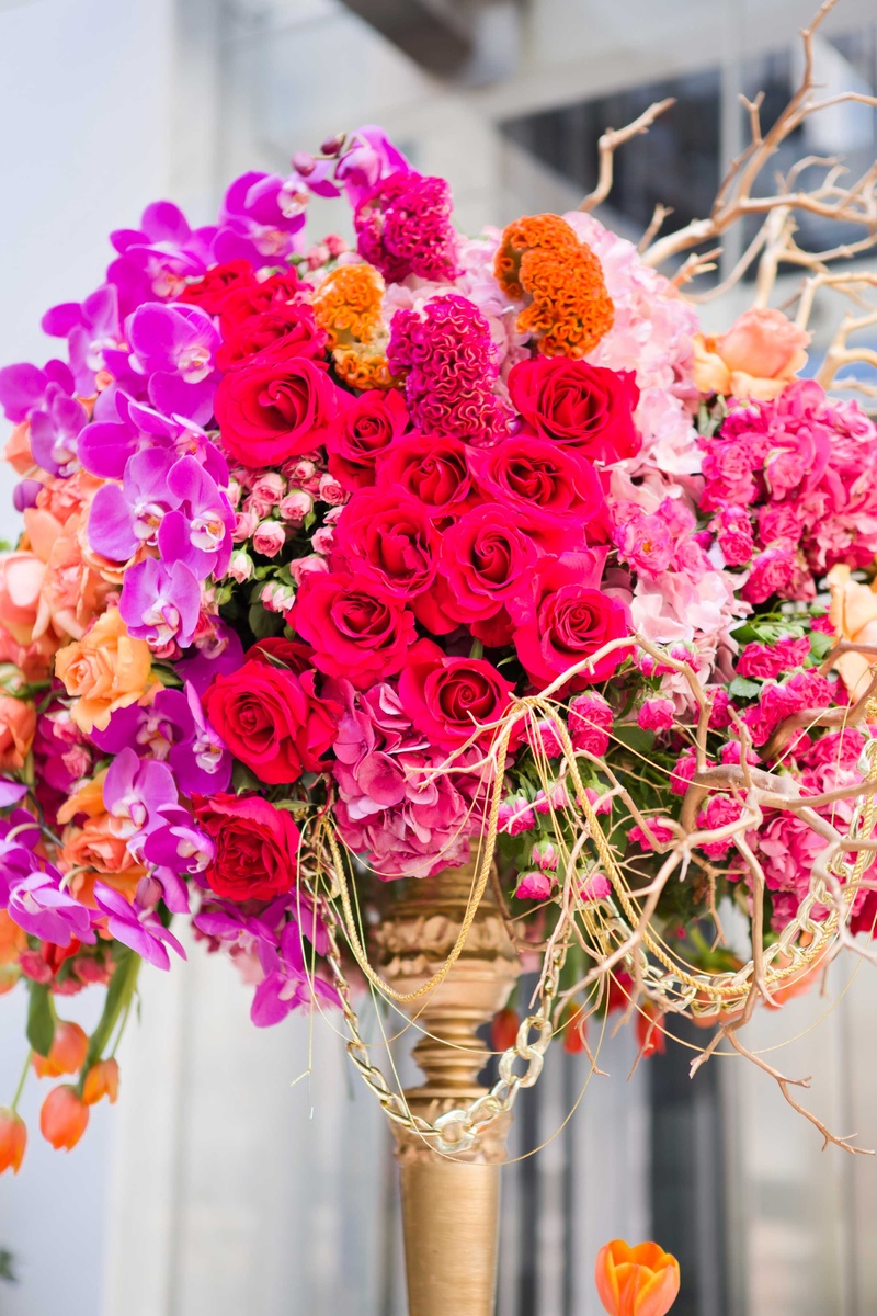 Jewel-Tone Blooms in Tall Centerpiece
Photography: Thisbe Grace Photography
Read More:
http://www.insideweddings.com/weddings/fall-inspired-wedding-styled-shoot-featuring-bold-metallic-details/868/ jewel tone blooms tall centerpiece roses orchids tulips branches gold details wedding reception