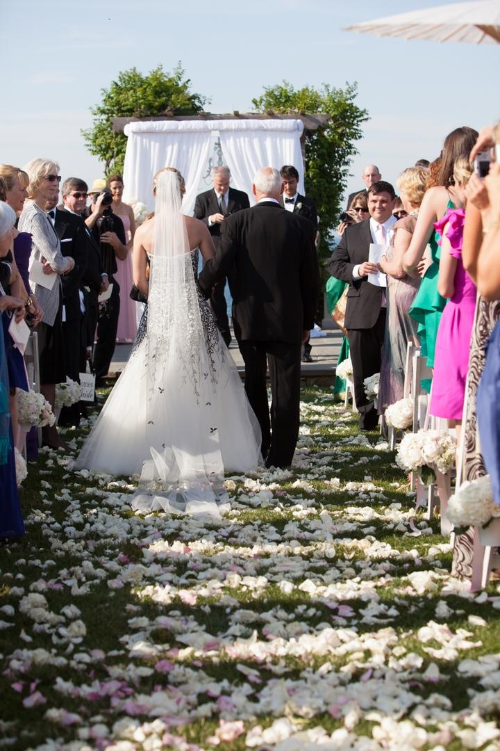 Flower Petal Aisleway
Photography: Carrie Rodman Photography
Read More:
http://www.insideweddings.com/weddings/new-england-summer-wedding-by-the-seashore/429/ Bride escorted down aisle by her father on grass