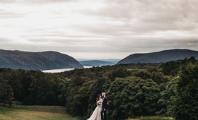 Sweeping Views of New York State
Photography: Justin Johnson Photography
Read More:
http://www.insideweddings.com/weddings/metallic-dusty-purple-color-palette-at-venue-with-stunning-views/1305/ bride and groom in front of sweeping views of field, trees, lake, and hills