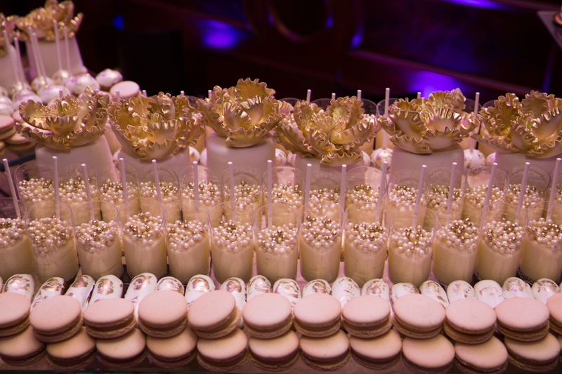 Wedding Dessert Table With Macarons Small Cakes Golden Fondant Peonies Pudding Cups Wedding Dessert Table With Macarons Small Cakes Golden Fondant Peonies Pudding Cups