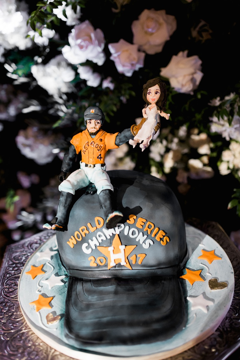Special World Series Champ Cake
Photography: Brett Hickman Photographers
Read More:
http://www.insideweddings.com/weddings/charlise-castro-and-george-springer-iii/1165/ George Springer III wedding cake groom's cake uniform houston astros baseball hat bride catch