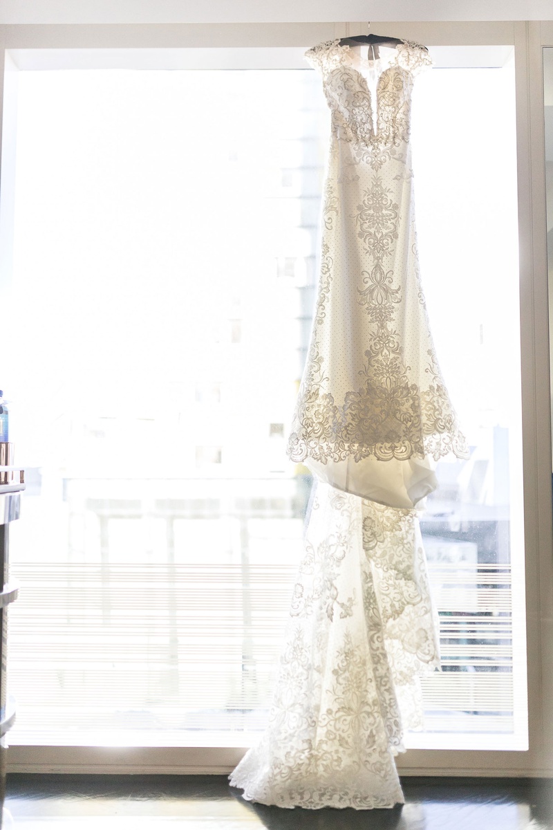 Wedding Dress with Long Train in Window
Photography: Brian Leahy Photography
Read More:
http://www.insideweddings.com/weddings/a-hawaiian-couples-luxurious-destination-wedding-in-las-vegas/1226/ cristiano lucci wedding dress with lace details cap sleeves and long train