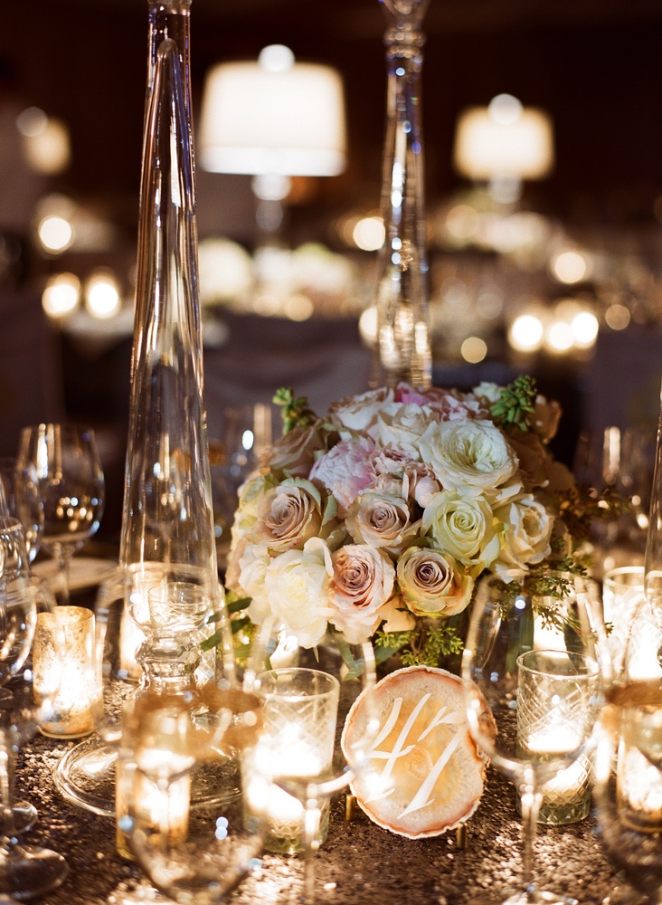Agate Table Number
Photography: Liz Banfield and Adrienne Page
Read More:
http://www.insideweddings.com/weddings/glittering-gold-new-years-eve-celebration-in-oklahoma-city/614/ Agate slice with calligraphy table number on sequin tablecloth