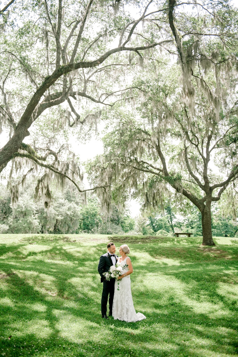 Bride %26 Groom in Charleston, South Carolina
Photography: Jennings King Photography
Read More:
http://www.insideweddings.com/weddings/alfresco-spring-destination-wedding-in-charleston-south-carolina/1277/ wedding portrait in wedding location grass lawn tall trees lowcountry south carolina destination