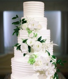 Fresh Flowers on Multiple Tiers
Photography: Clane Gessel Photography
Read More:
http://www.insideweddings.com/weddings/ocean-view-ceremony-with-cultural-traditions-elegant-reception/1291/ crisp white wedding cake with fresh flowers down the tiers