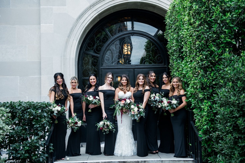 Off-the-Shoulder Black Bridesmaid Dresses
Photography: Kim Fox Photography
Read More:
http://www.insideweddings.com/weddings/luxe-vintage-inspired-winter-wedding-in-downtown-los-angeles/1082/ Bride in white dress sweetheart neckline with bridesmaids in black off shoulder bouquets burgundy