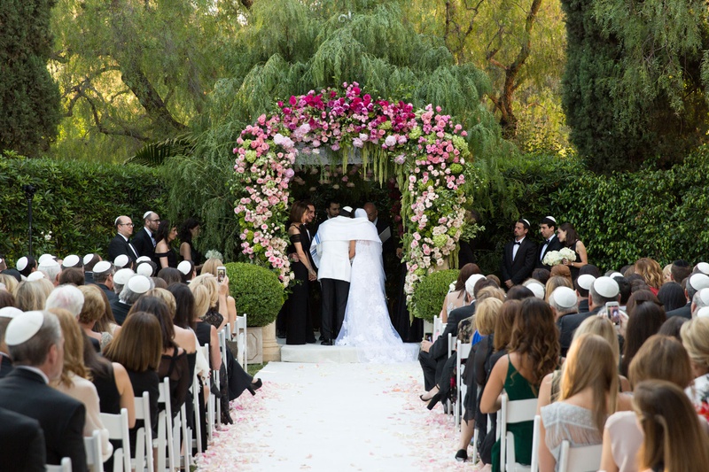 Jewish Ceremony with Pink %26 Green Chuppah
Photography: Jay Lawrence Goldman Photography
Read More:
http://www.insideweddings.com/weddings/outdoor-ceremony-ballroom-reception-with-pink-flowers-greenery/1135/ Wedding ceremony at the beverly hills hotel groom in white jacket pink white green wedding arch