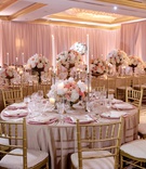 Tall Taper Candles %26 Low Centerpiece
Photography: Milanés Photography
Read More:
http://www.insideweddings.com/weddings/opulent-ballroom-wedding-with-coral-gold-color-palette-in-atlanta/1240/ wedding reception gold chairs soft linens tall taper candles gold footed vessels pink white flowers