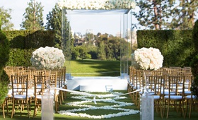 Lucite Outdoor Ceremony Structure
Photography: Duke Photography
Read More:
http://www.insideweddings.com/weddings/alfresco-ceremony-modern-reception-in-southern-california/1123/ Wedding ceremony grass lawn country club gold chairs white flower petal aisle runner lucite acrylic