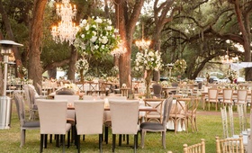 Glam Rustic Outdoor Reception
Photography: Michael Carr Photography
Read More:
http://www.insideweddings.com/weddings/glamorous-outdoor-wedding-with-rustic-rose-gold-details-in-texas/842/ Wedding reception on grass lawn among trees in Texas planned by Ann Whittington rustic chic