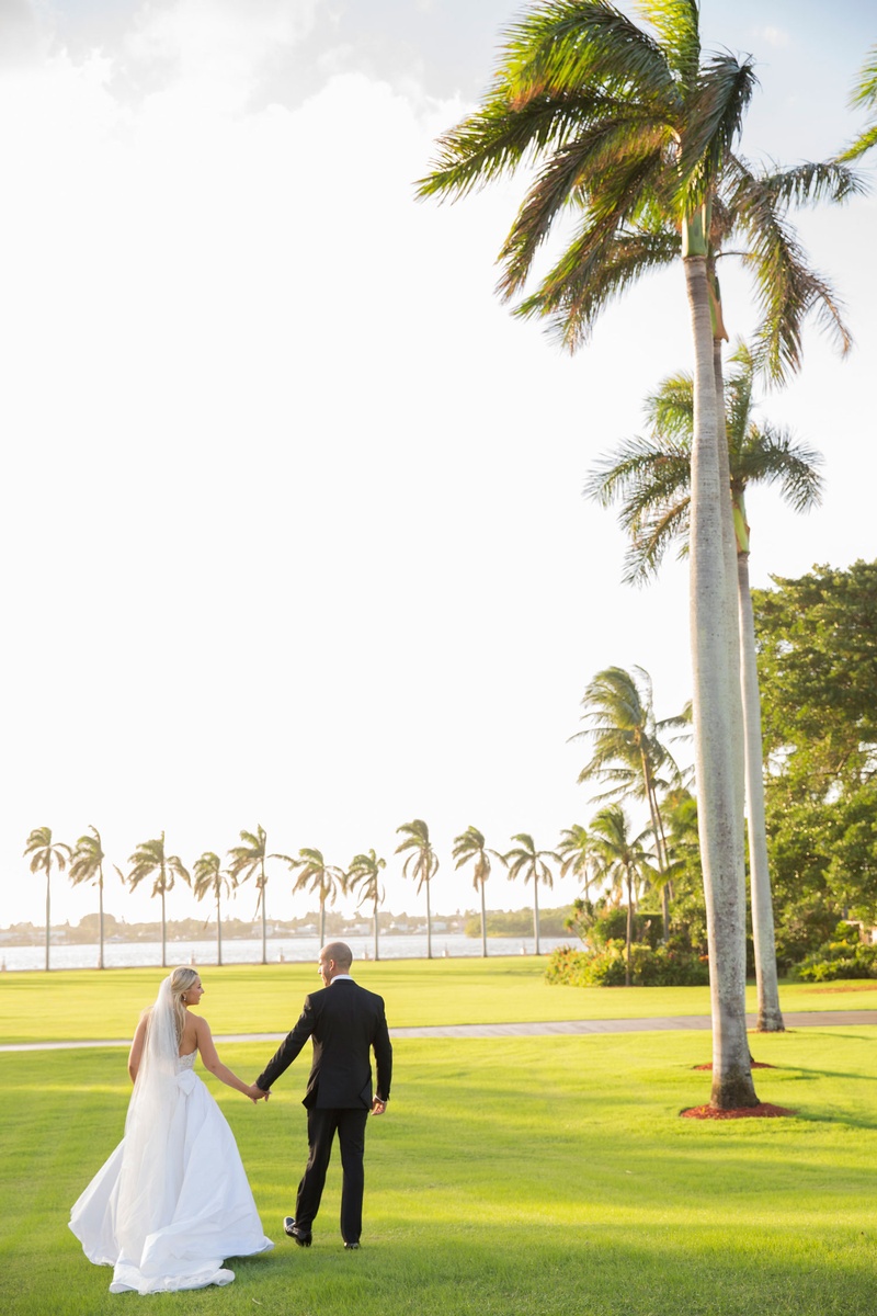 Bride %26 Groom Walking in Palm Beach
Photography: Nancy Cohn Photography
Read More:
http://www.insideweddings.com/weddings/destination-wedding-with-white-gold-color-palette-in-palm-beach/1028/ Wedding portrait couple bride and groom tuxedo veil tall palm trees