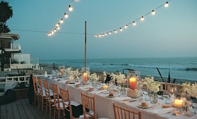 Oceanfront Dinner Seating
Photography: Suzanne Karp Photography
Read More:
http://www.insideweddings.com/weddings/seaside-wedding-in-california-with-beach-themed-decor/45/ A long reception table boasted ocean views