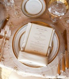 White and Gold China
Photography: Barber Photography
Read More:
http://www.insideweddings.com/weddings/pink-white-summer-wedding-at-the-resort-at-pelican-hill/314/ Beaded linens topped with gold-rimmed plates