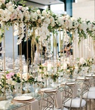 Lofted Garland Runner
Photography: Jenny Haas Photography
Read More:
http://www.insideweddings.com/weddings/detroit-lions-taylor-deckers-timeless-wedding-at-ohio-statehouse/1278/ long glass tables with a floating garland runner on thin gold stands