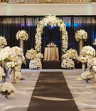 Ceremony Full of Flowers
Photography: Kortnee Kate Photography
Read More:
http://www.insideweddings.com/weddings/glitzy-glamorous-wedding-with-black-gold-palette-in-cincinnati/1056/ indoor wedding with black, gold, and ivory, multiple flower arrangements