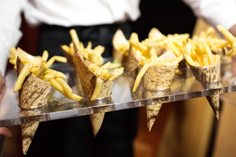 Late-Night Fries on Tray
Photography: Perez Photography
Read More:
http://www.insideweddings.com/weddings/incredible-tented-ceremony-barn-reception-at-ranch-in-aspen/860/ French fry snacks in cones as late night snack for wedding reception