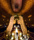 Ceremony Processional with High Ceiling
Photography: Roey Yohai Studios
Read More:
http://www.insideweddings.com/weddings/destination-wedding-with-vintage-art-deco-elements-in-new-york-city/1157/ bride in julie vino wedding dress walking down aisle with dad tall ceiling gotham hall drapes lights