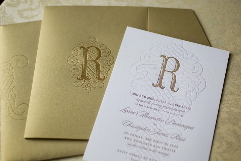 Invitation with Golden Details
Photography: Images by Berit, Inc.
Read More:
http://www.insideweddings.com/weddings/wedding-with-purple-modern-details-at-a-chateau-in-new-jersey/693/ White wedding invitation stamped with the letter R and wavy design, gilt envelopes