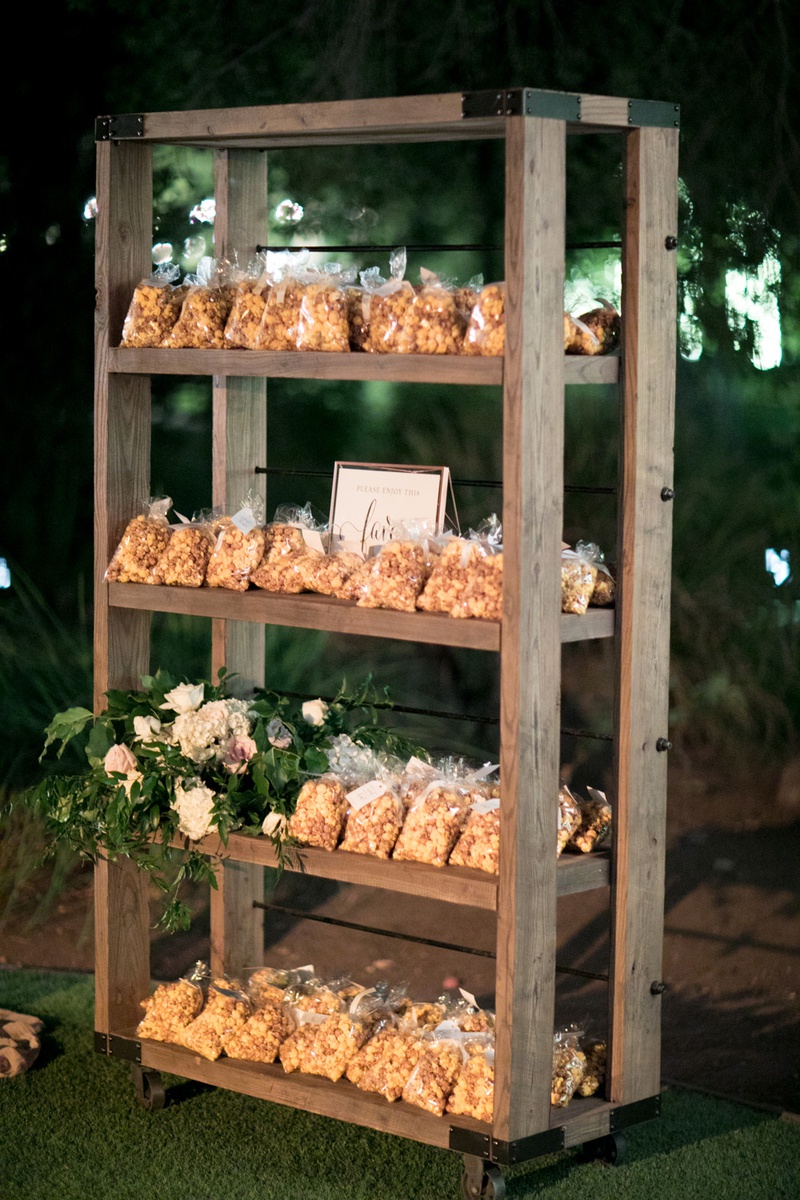 Popcorn Favors
Photography: Michael Segal Photography
Read More:
http://www.insideweddings.com/weddings/alfresco-wedding-with-a-rose-inspired-palette-at-a-ranch-in-malibu/1251/ garrett's popcorn chicago mix wedding favors, cheddar and caramel popcorn